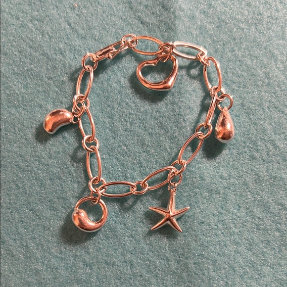 Tiffany & Co Elsa Peretti 925 Charm Bracelet with 5 of her most famous Charms.